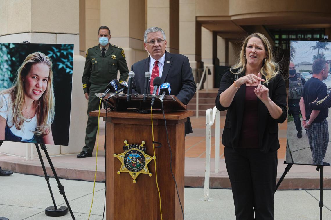 Cal Poly President Jeffrey Armstrong speaks at a news conference on Tuesday, April 13, 2021, announcing the arrests of Paul Flores and Ruben Flores in the disappearance of Cal Poly student Kristin Smart in 1996. San Luis Obispo County Sheriff Ian Parkinson stands in background and interpreter Robin Babb is at right. The photo at right shows Paul Flores being arrested at his home in San Pedro.
