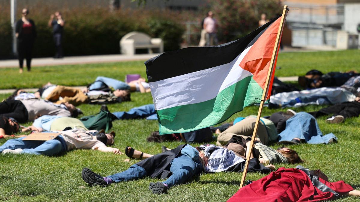 About 70 people gathered on Cal Poly’s Dexter Lawn on May 1, 2024, to stage a silent die-in in support of Palestine.