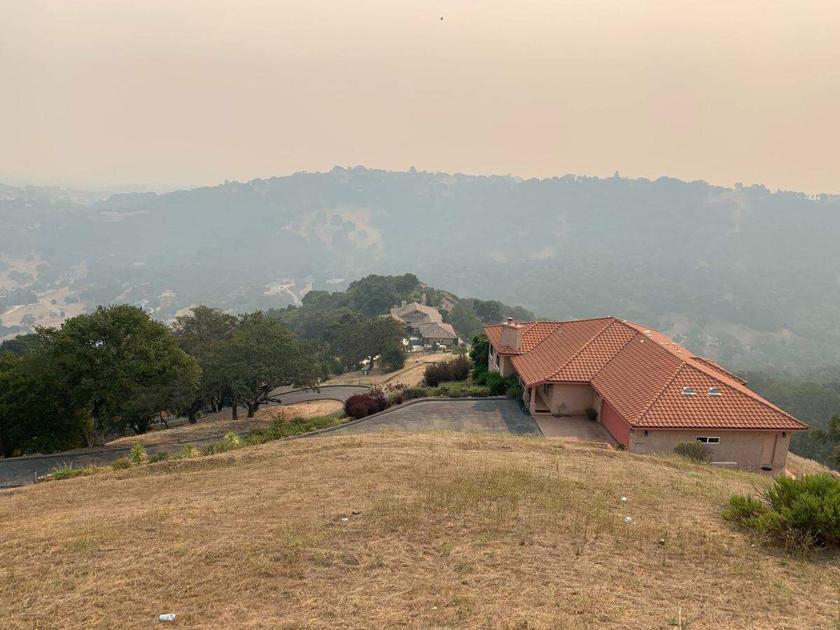 Smoke from wildfires can be seen in the sky above San Marcos Road looking toward Atascadero on Wednesday, Aug. 19, 2020.