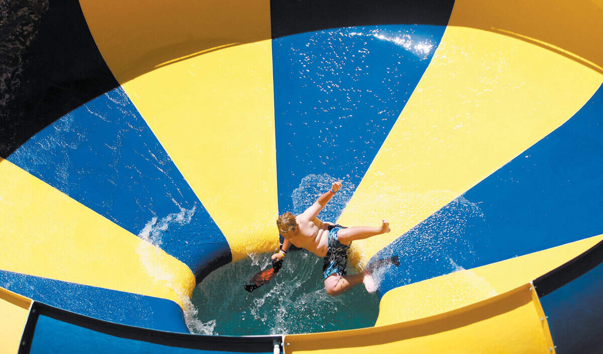 Logan O'Grady,12, plunges out of the vertigo Body Bowl at The Ravine  Waterpark next to Highway 46 in Paso Robles.
