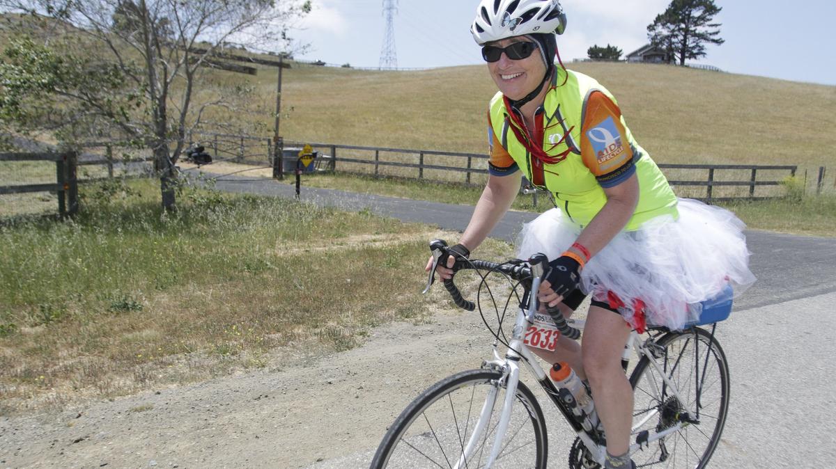 Dayon Jonson of San Francisco rides with a white tu-tu on in honor of longtime AIDS/LifeCycle friend Edna Flores, who passed away on one of the rides years ago.