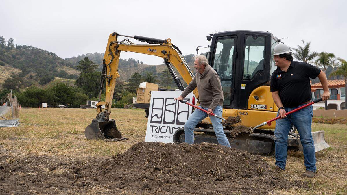 Property owner Tom McNeal and Tricamo Construction owner John Tricamo break ground on the Solemar project on Tuesday, May 12, 2026. The Solemar housing project will consist of eight custom homesites, 12 townhomes and a pair of homes for the McNeal family, which owns the property,