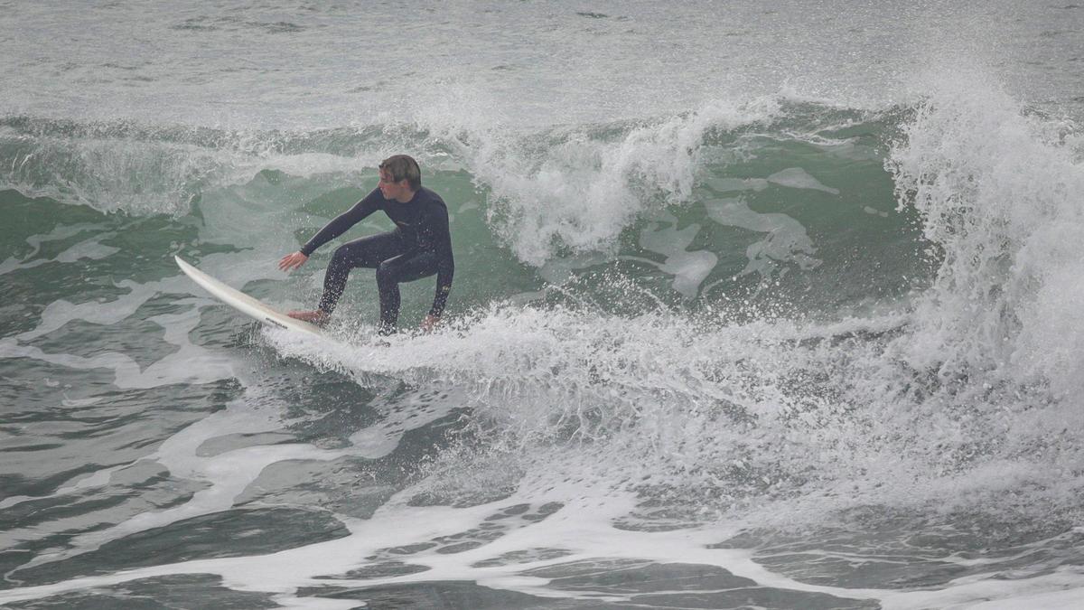 Surfers turned out to enjoy the waves at Cayucos as a storm builds in Dec. 27, 2023.