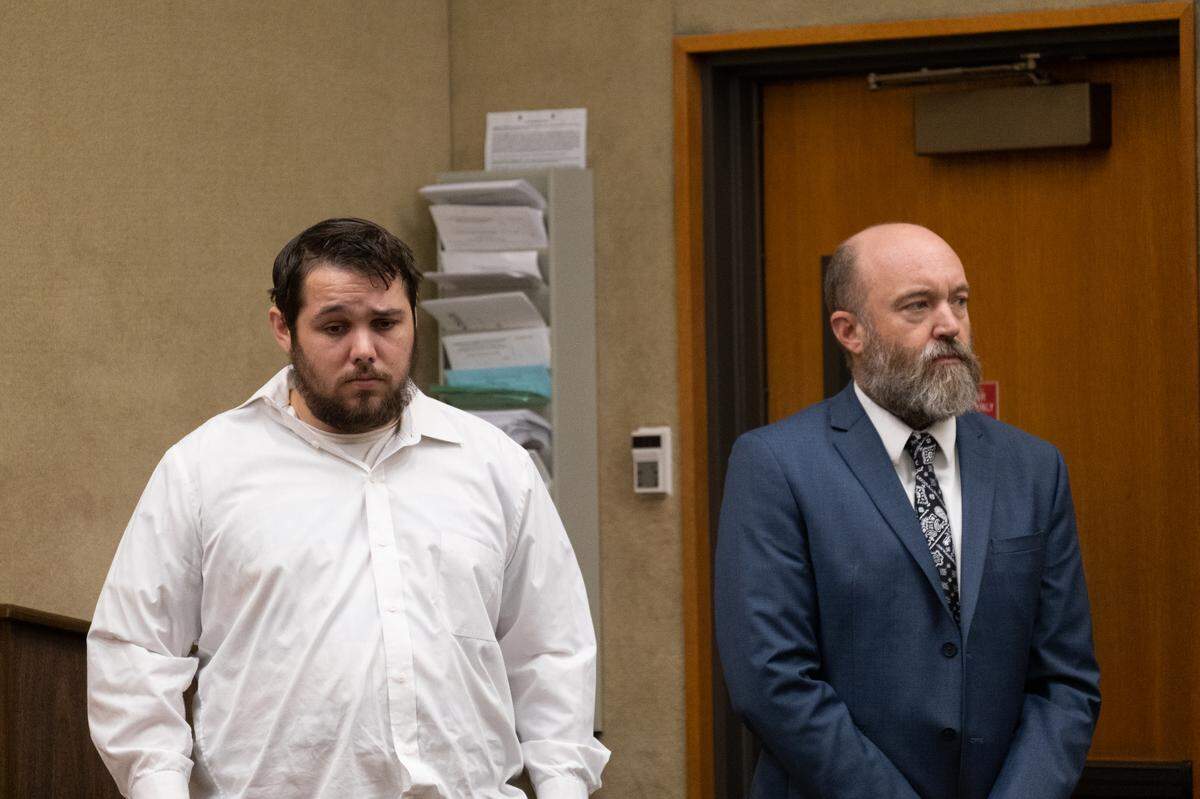 Justin Tray Buchanan, left, stands next to his lawyer, Steve Rice, during a court hearing at San Luis Obispo Superior Court on Aug. 3, 2023.