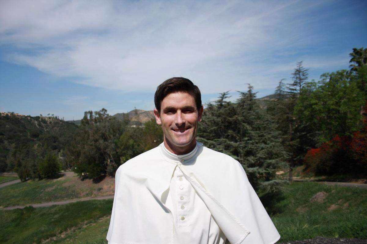 Former Cal Poly baseball star Grant Desmé, pictured here wearing a white habit while training to become a Cathloic priest at St. Michael’s Abbey of the Norbertine Fathers in Silverado in 2016, returned to professional baseball this year, nine years retiring from the Oakland A’s organization.