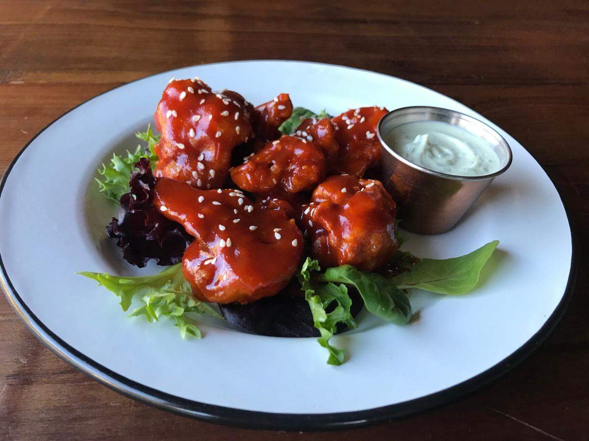 Spicy Korean cauliflower wings are served with creamy cilantro dipping sauce at Halfway Station in Atascadero.
