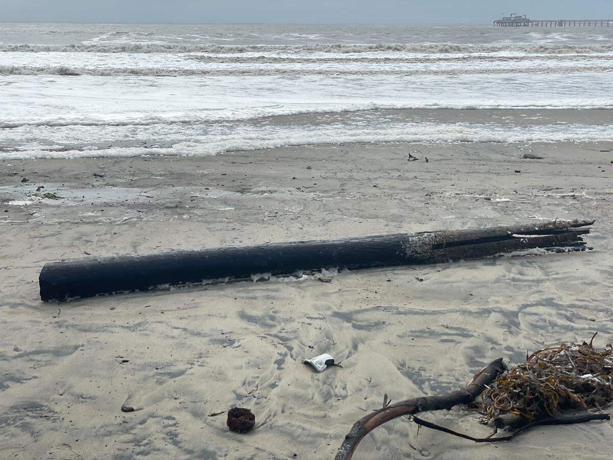 A pier piling rests on the sand in Avila Beach on Thursday, Jan. 5, 2023, following a powerful winter storm.