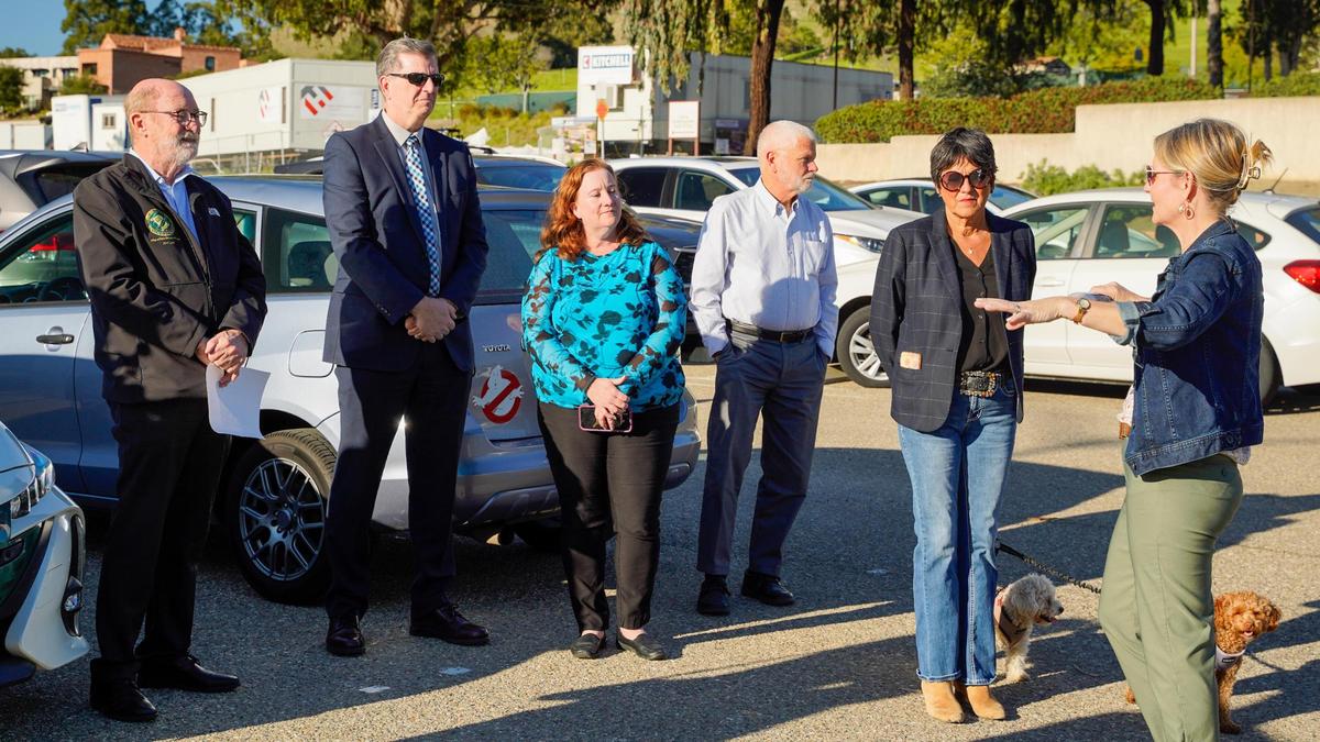California state Sen. John Laird, left, and San Luis Obispo County Department of Social Services director Devin Drake, deputy director Linda Belch, District 2 Supervisor Bruce Gibson and District 3 Supervisor Dawn Ortiz-Legg listen to a presentation at the future location of the Welcome Home Village transitional housing project in San Luis Obispo on Thursday, Feb. 20, 2025. 