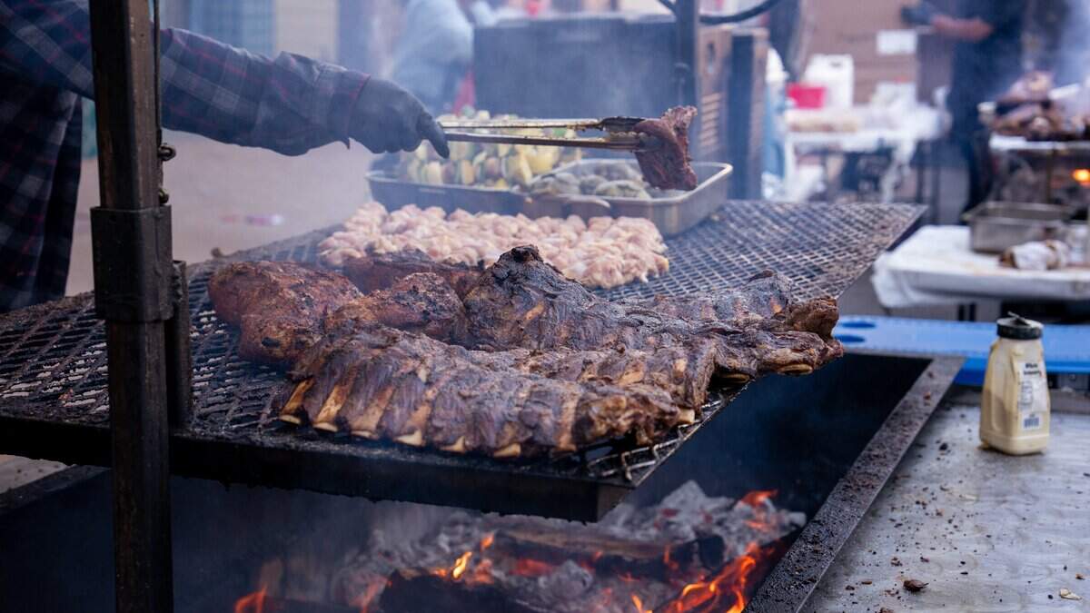 Tri-tip, chicken drumsticks, artichokes and vegetable kebabs are seasoned and grilled at Vix Creek Saloon’s booth at the Downtown SLO Farmers Market on June 25, 2025. Victor Albarran, a former F. McLintocks employee, opened his restaurant in the old steakhouse in Arroyo Grande and now occupies the popular restaurant’s former space at the market.