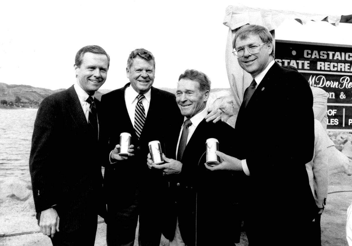 Former Los Angeles County Supervisor Warren Dorn, second from left, is surrounded by old friends — then-U.S. Sen. Pete Wilson, physical fitness promoter Jack LaLanne and Chairman Pro Tem Mike Antonovich of the Los Angeles County Board of Supervisors — in front of a sign designating the Warren M. Dorn Recreation Complex at Lake Castaic on Jan. 13, 1986.