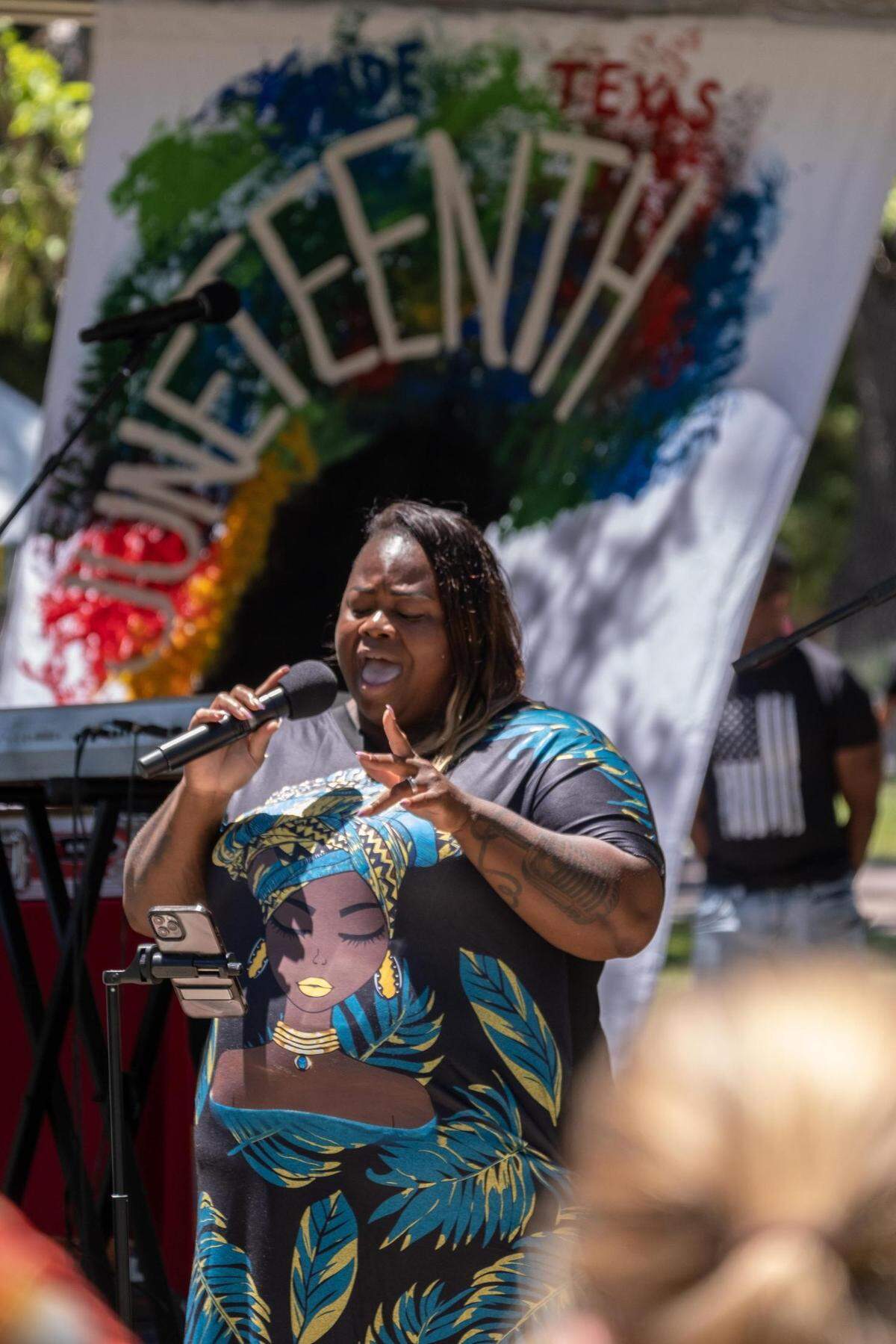Ashley Brown sings “Lift Every Voice and Sing,” also called the Black national anthem, during the Juneteenth Jubilee in downtown Paso Robles on June 18, 2022.
