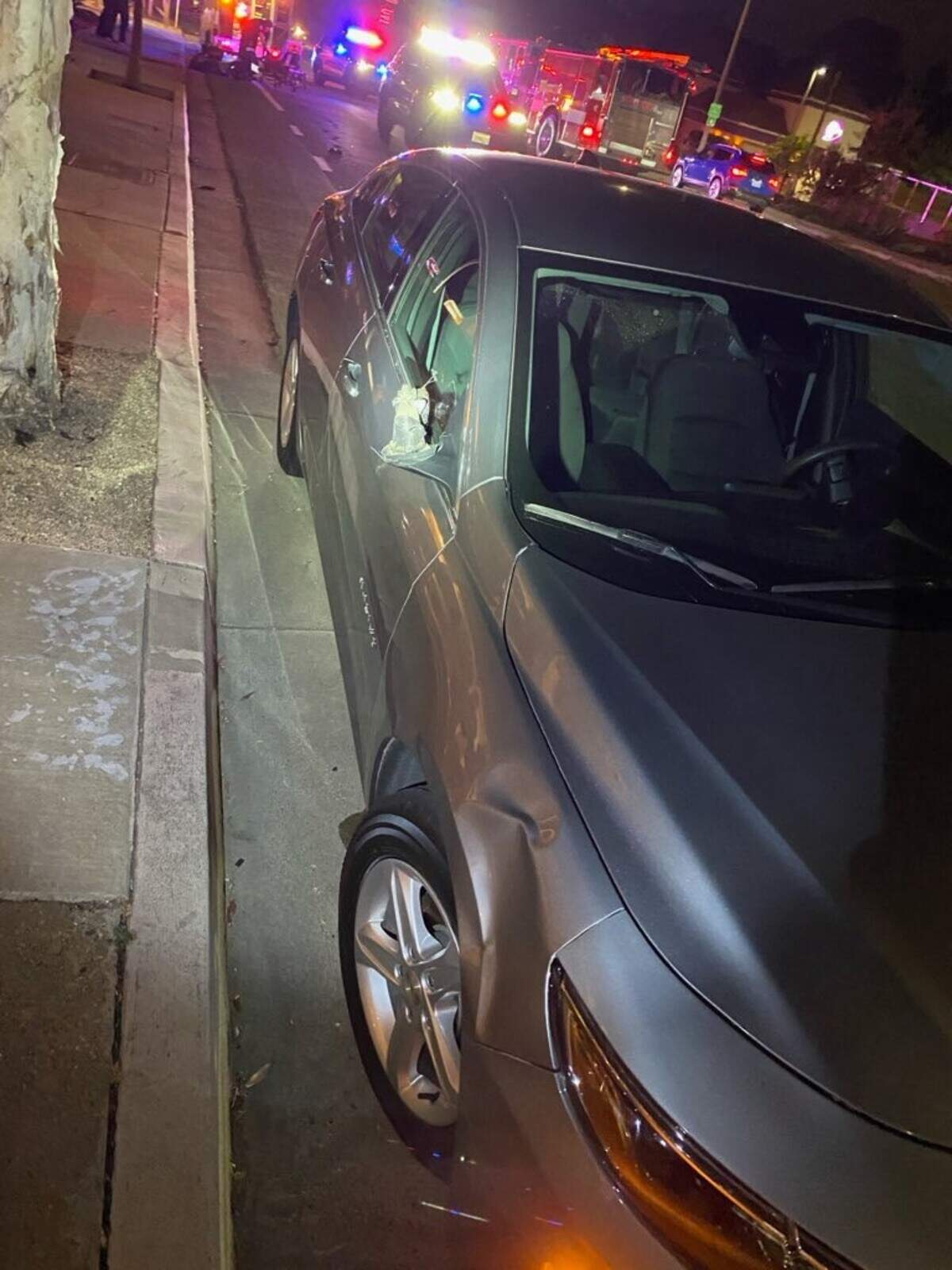 A car after it struck a pedestrian who was crossing mid-block on Santa Rosa Street near Taco de Mexico on June 9, 2025.