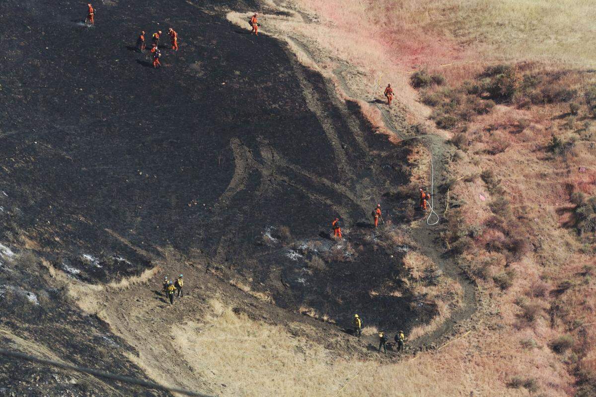 Firefighters on May 24 mop up any additional areas still burning in a fire northeast of Santa Maria off Highway 166 and Bull Canyon Road in southern San Luis Obispo County.