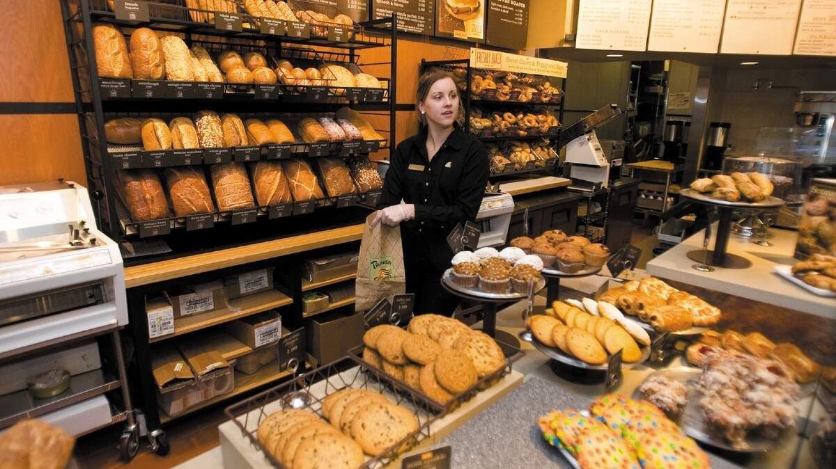 Lynsey Cates talks to VIP guests about items at the new Panera Bread in San Luis Obispo on Friday.