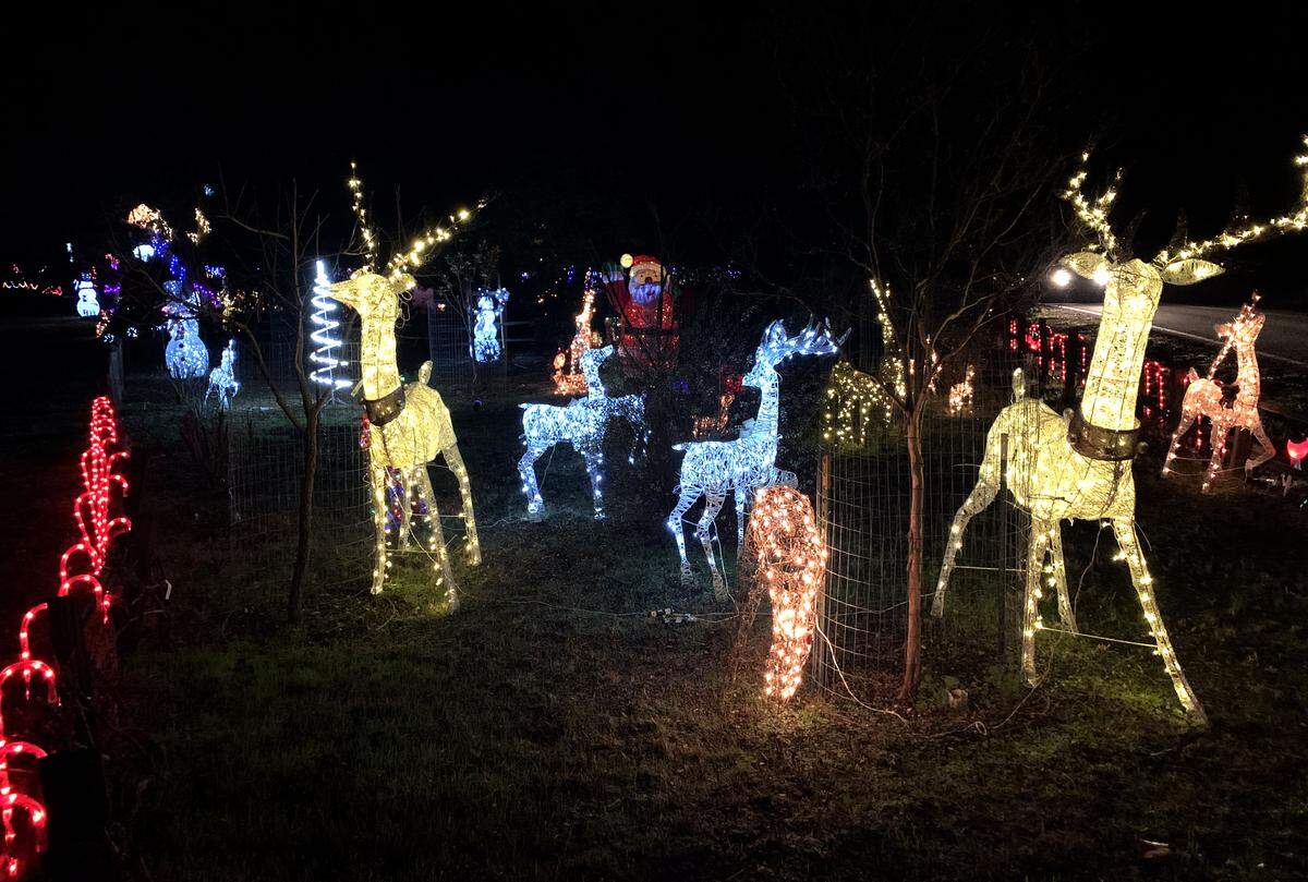 A large holiday light display illuminates the corner of Curbaril and Marchant avenues in Atascadero.