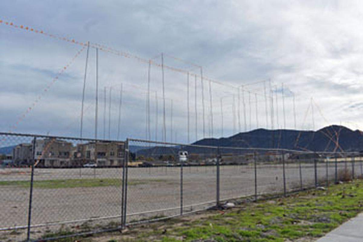 Story poles topped with flags are posted at the site of the two proposed hotels off McMurray Road in Buellton.