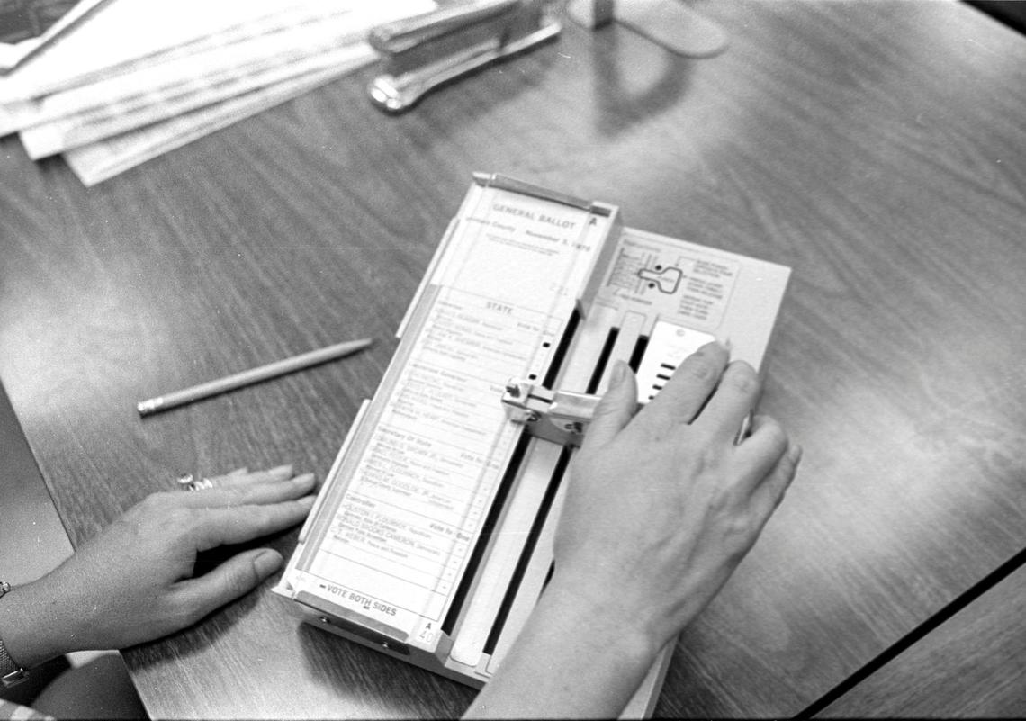 Diane Maddux, a deputy San Luis Obispo County clerk, demonstrates new punch card voting machine on Aug. 27, 1975. The Diamond International system replaced old Shoup Voting Machines that came into service in 1957.