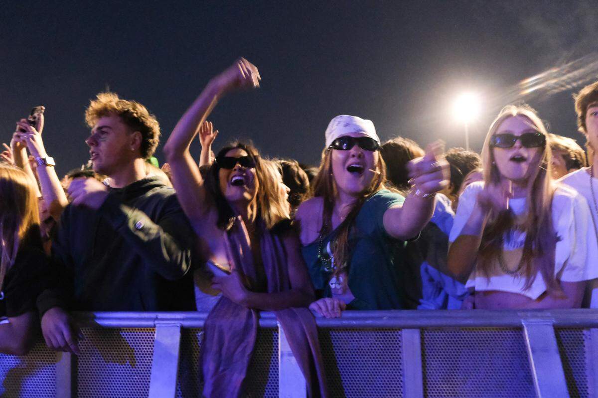 Third-year Cal Poly students Jamison Grospe, center left, and Haley Sandstrom enjoy watching Galantis perform at Cal Poly’s “Morning on the Green” music festival on March 15, 2025. The festival was sponsored by the university to give students a safer option instead of partying in the streets on St. Fratty’s Day.