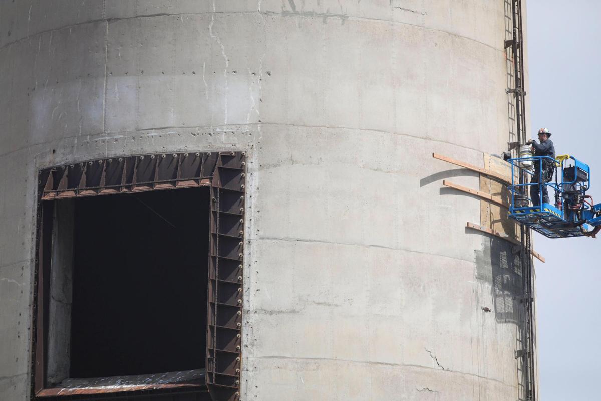 A construction crew performed routine maintenance on a 450-foot-tall Morro Bay Power Plant smoke stack on April 23, 2025. This was the first of three stacks that were built on the site and dedicated July 7, 1955, almost 70 years ago.