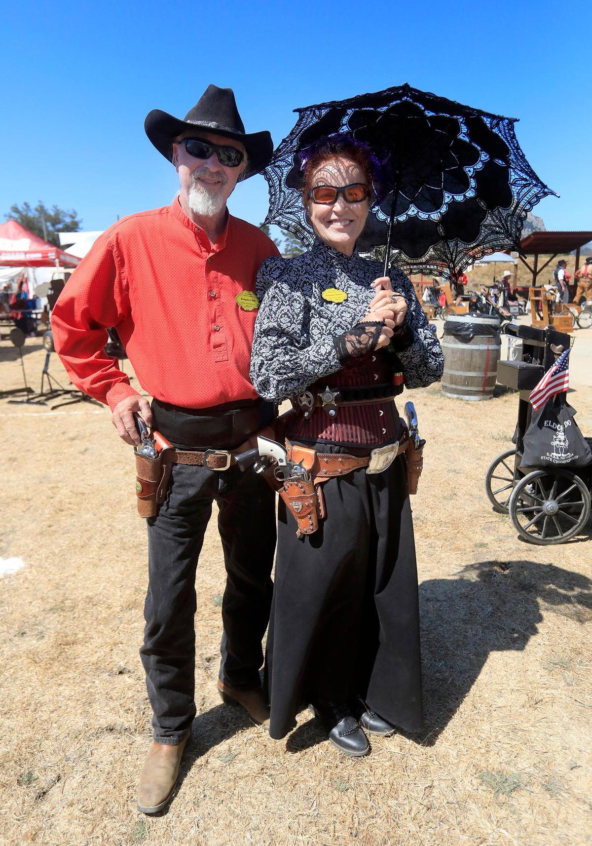 All dressed for the competition are, Paul “Bungalow Bill” Mathias and his wife Colleen “Rainbow Dancer” Mathias of San Bernardino County are participants in the 25th annual Chorro Valley Shootout, an Old West-style competition, on Friday at the Chorro Valley Regulators range, located at the SLO Sportsman’s Association Shooting Facility on Hwy. 1.