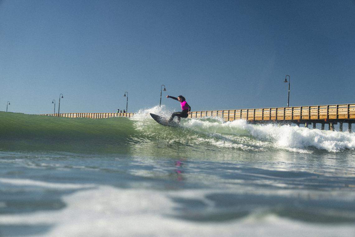 A surfer competes in the third annual Diva Cup Surf Invitational, San Luis Obispo County’s only woman’s surf competition, in Cayucos on Nov. 22, 2025.