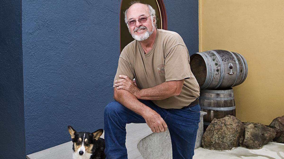Winemaker Stuart Selkirk, a Cayucos native, pauses with his dog, Sadie.