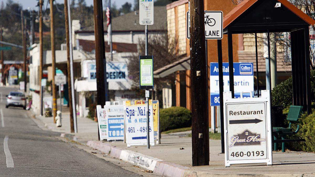 Several businesses along Atascadero's El Camino Real have sandwich-board signs on the sidewalk in violation of the city's sign ordinance.