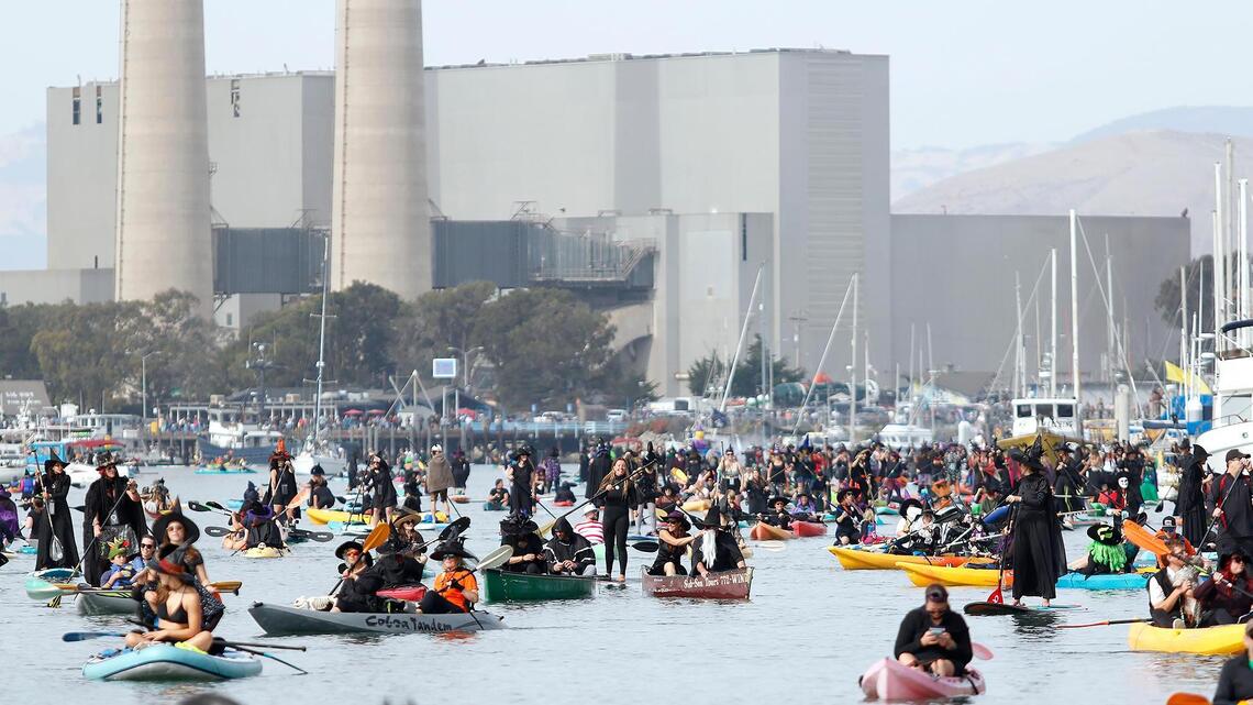 Hundreds of witches and warlocks turn out to paddle and cackle in Morro Bay. See the photos