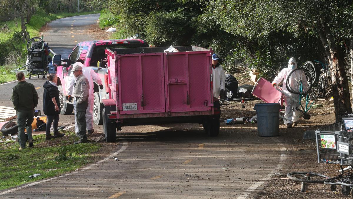 Workers dismantle homeless camps on the Bob Jones Trail near Prado Road in San Luis Obispo on Jan. 7, 2022 in advance of work along the creek to reduce fire risk, upgrade trail fencing and improve flood control.