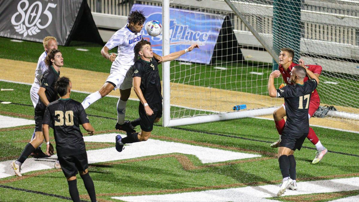 UCSB’s Salvador Aguilar heads the ball over Cal Poly’s Sebastien Maza for the winning goal. Cal Poly fell to UCSB 2-1, though the game had been tied with 12 seconds to go.