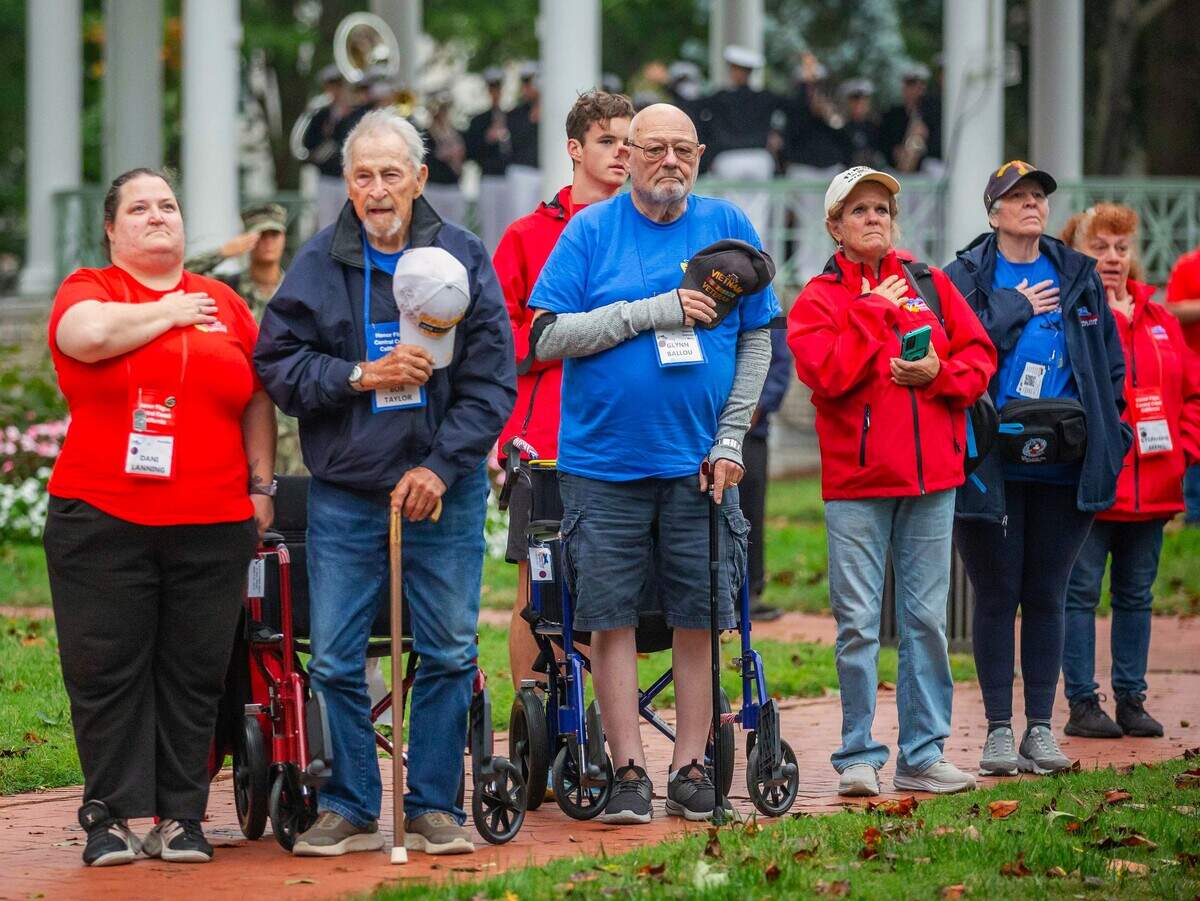 Veterans and guardians with Honor Flight Central Coast California participate in a ceremony during a trip to Washington, D.C. The nonprofit organization has taken hundreds of Central Coast veteran honorees to visit military memorials and historic sites since 2014.