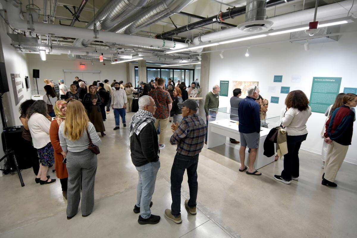 People attend the opening event for the Mawtini installation at Cal Poly’s Kennedy Library, which, honors the oral histories of Arab Americans in SLO. It officially launched on Jan. 24, 2026, and will remain through March 20.