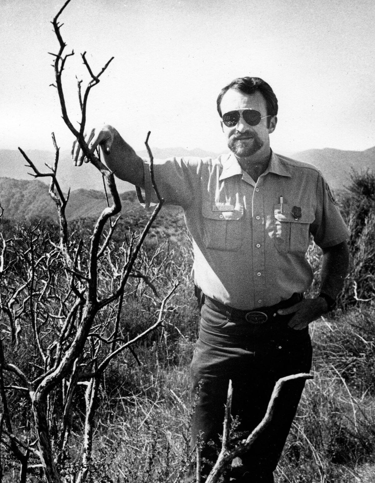 Doug Aversano stands in remains of Las Pilitas fire on Hi Mountain in 1988.