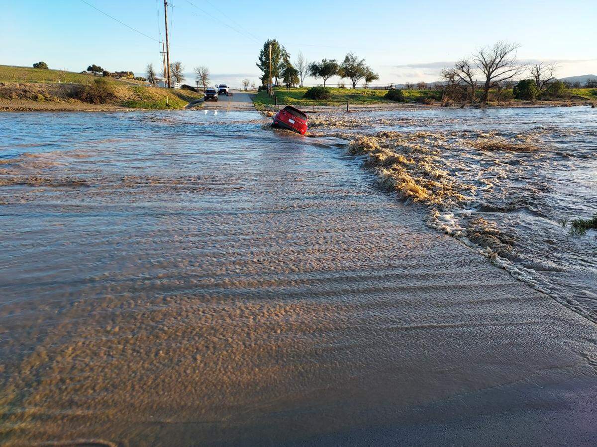 A mother and her three children were rescued in rural Paso Robles on Thursday, March 23, 2023, after floodwaters swept their car off North River Road and into the Estrella River.