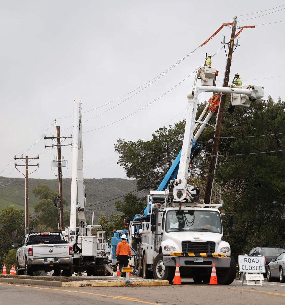 PG&E crews straighten a sagging power pole on westbound South Street in San Luis Obispo on Thursday, Jan. 5, 2023, resulting in detours for drivers.