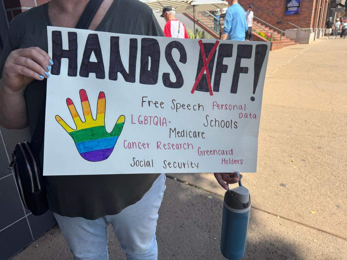 Stephanie Drexler traveled from Atascadero for the hands off rally in San Luis Obispo. Her 15-year-old daughter, Sydney, chose the wording for the sign.