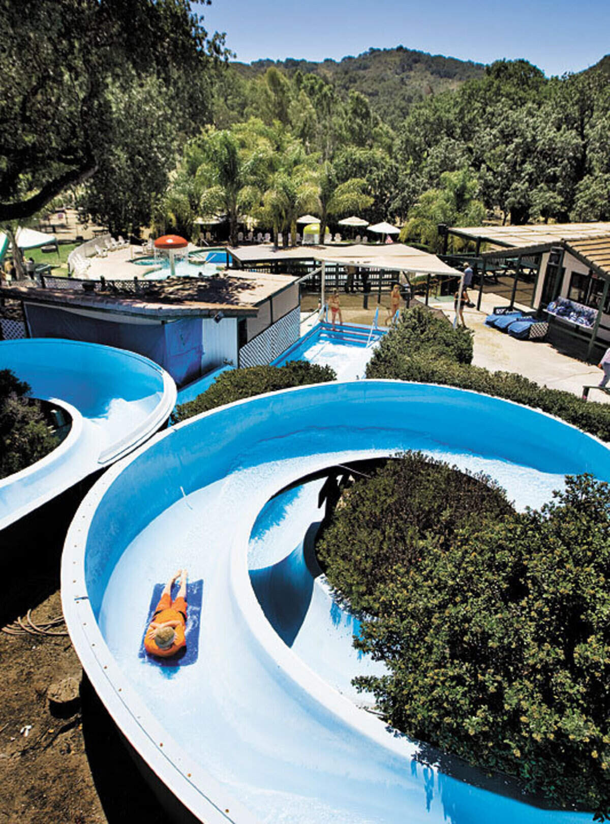 A visitor slips down a slide at the Mustang Waterpark at Lopez Lake in 2012.