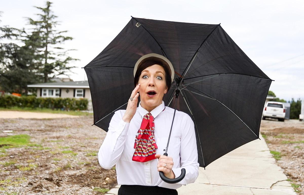 Casandra Cox is startled as a loud trucker honks at her and her family. Cox and her family dress up every day to wave at cars passing their Arroyo Grande home on Highway 1, sharing positive messages and smiles during the coronavirus pandemic. On Thursday, they dressed as “Mary Poppins” characters.