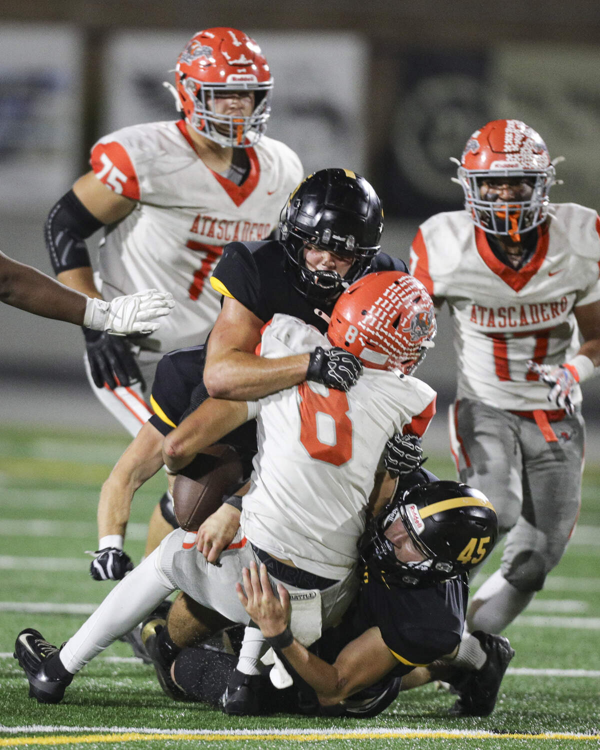 Cooper Knoph is sacked by Clint Wheeler and Grady Garrison. San Luis Obispo beat Atascadero 38-14 on Sept. 11, 2026.