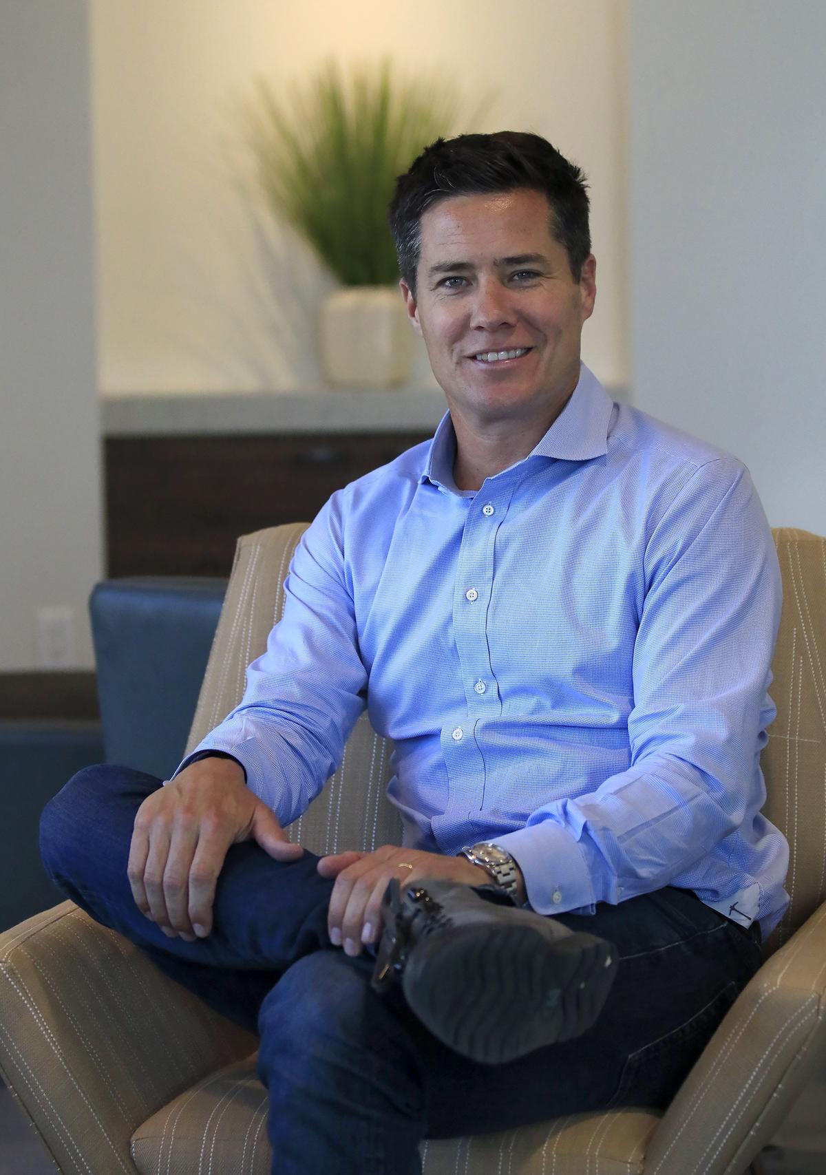 Andrew Firestone sits in a lounge area on the second floor of the La Quinta Inn & Suites by Wyndham, which opened in San Luis Obispo in 2019.