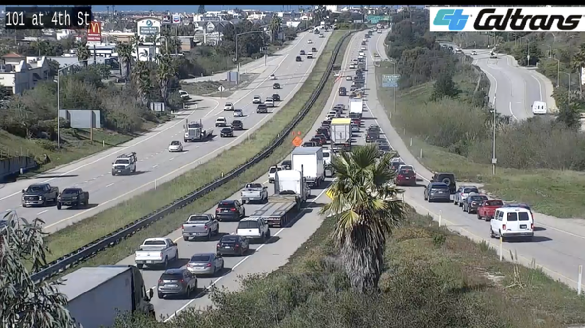 Spilled mud on the roadway at slowed northbound traffic on Highway 101 at the N Oak Park Blvd offramp.