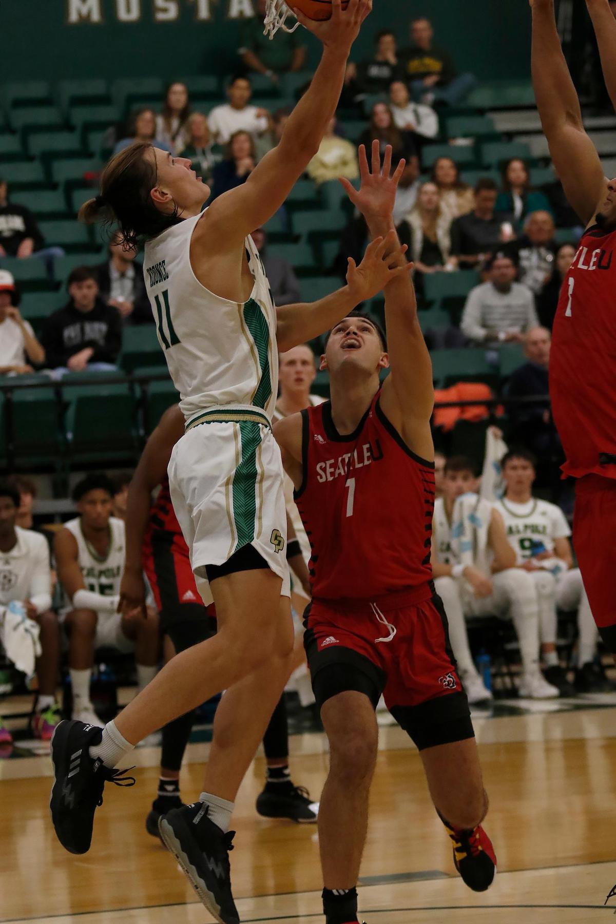 Cal Poly’s Owen Koonce shoots over Seattle University’s Maleek Arington. Cal Poly beat Seattle University 75-71 in a college basketball game at Mott Athletics Center on Nov. 14, 2024.