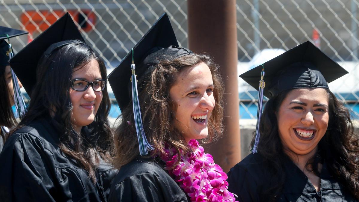 Hilary Carolina Morales, Victoria White and Aileen Deloya get ready to enter gym for diplomas at 2019 Cuesta graduation. Cuesta College graduated 1,069 students on Friday, including 239 graduates who earned honors or high honors; of those 14 earned a perfect 4.0 graduate point average. David Middlecamp 5-24-2019