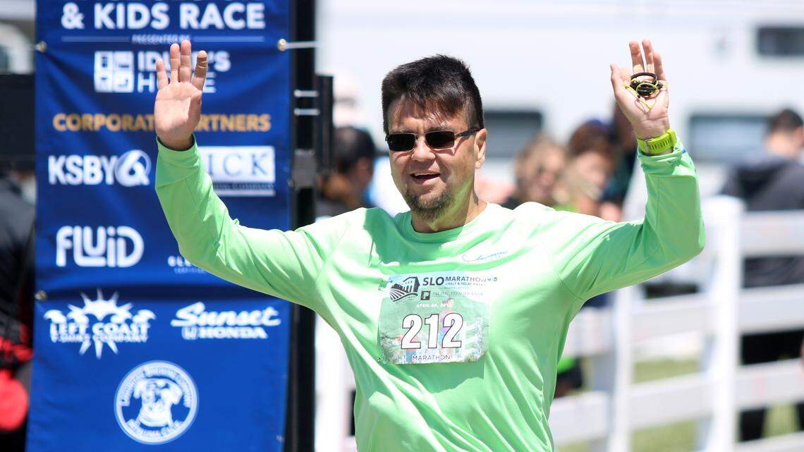 James Lacher, a 46-year-old San Luis Obispo bus driver, crosses the finish line at the San Luis Obispo Marathon on Sunday, April 29, 2018, four years after weighing more than 400 pounds.