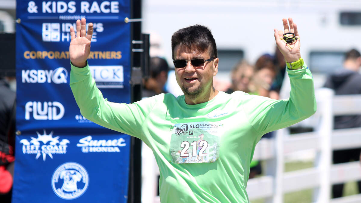 James Lacher, a 46-year-old San Luis Obispo bus driver, crosses the finish line at the San Luis Obispo Marathon on Sunday, April 29, 2018, four years after weighing more than 400 pounds.