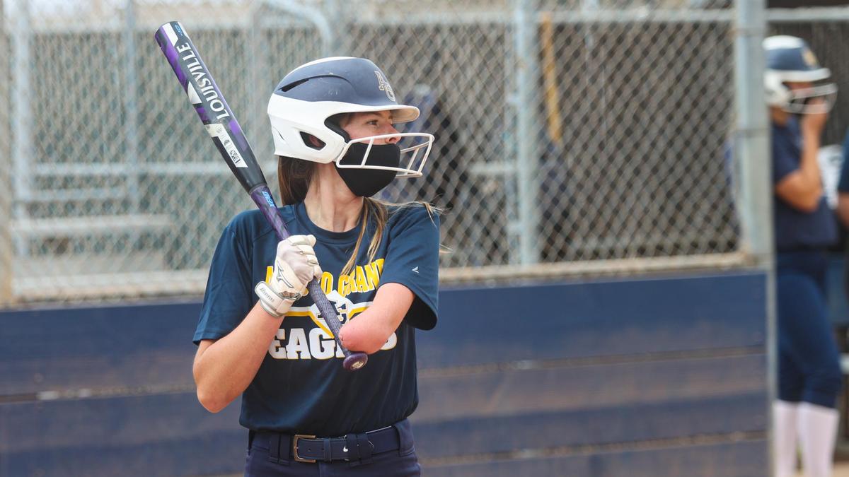 Riley Osborne, a sophomore outfielder for Arroyo Grande High School’s softball team, was born with a partial left arm. She bats one-handed, using her “little arm” for balance.