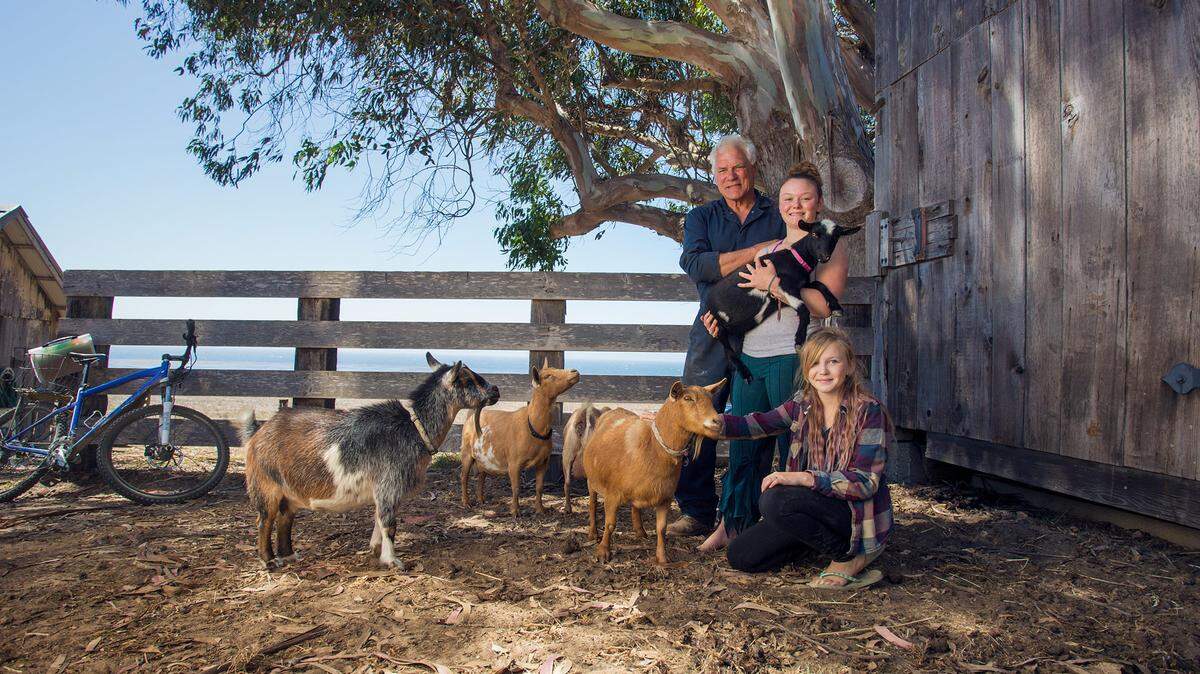 Don Canestro with daughters Carla, 13, and Stella, 11, and their pet goats in 2016, outside the barn near their home on the UCSB Norris Rancho Marino Reserve in Cambria.