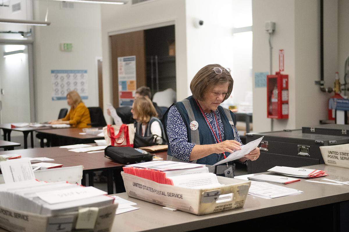 Vote-by-mail ballots are sorted at the San Luis Obispo County elections office.