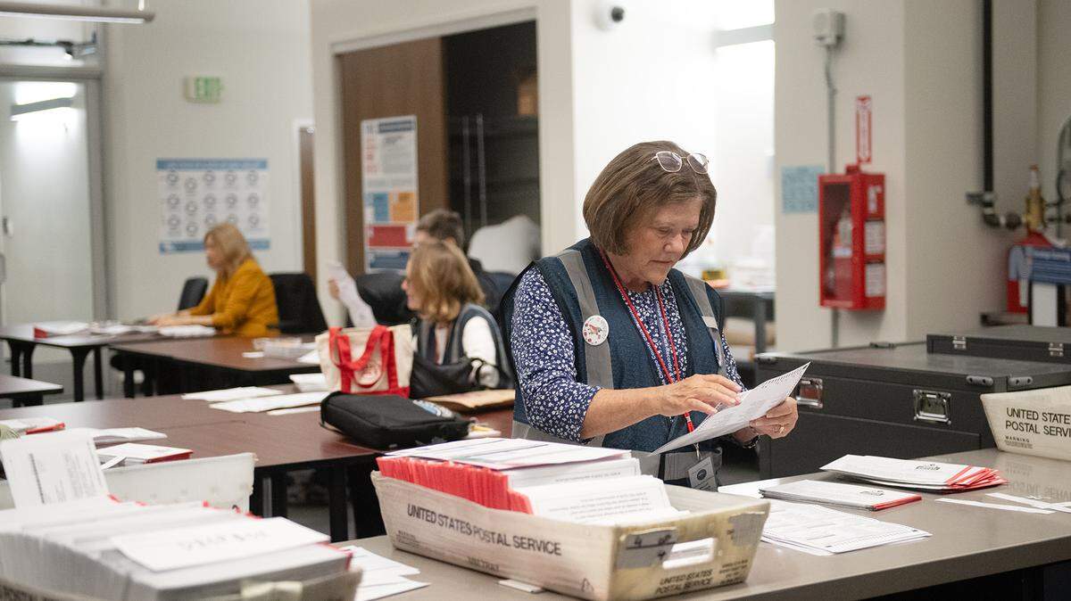Vote-by-mail ballots are sorted at the San Luis Obispo County elections office.