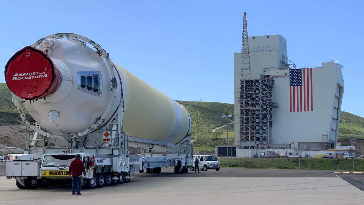 A Delta IV Heavy booster from a United Launch Alliance barge, known as the RocketShip, proceeds to the Horizontal Integration Facility May 4, at Vandenberg Air Force Base, Calif. A HIF is a building within which the stages of a multistage rocket are brought together before the assembled stack is rolled out to the launch pad or space launch complex and raised into a vertical position for final integration and launch.